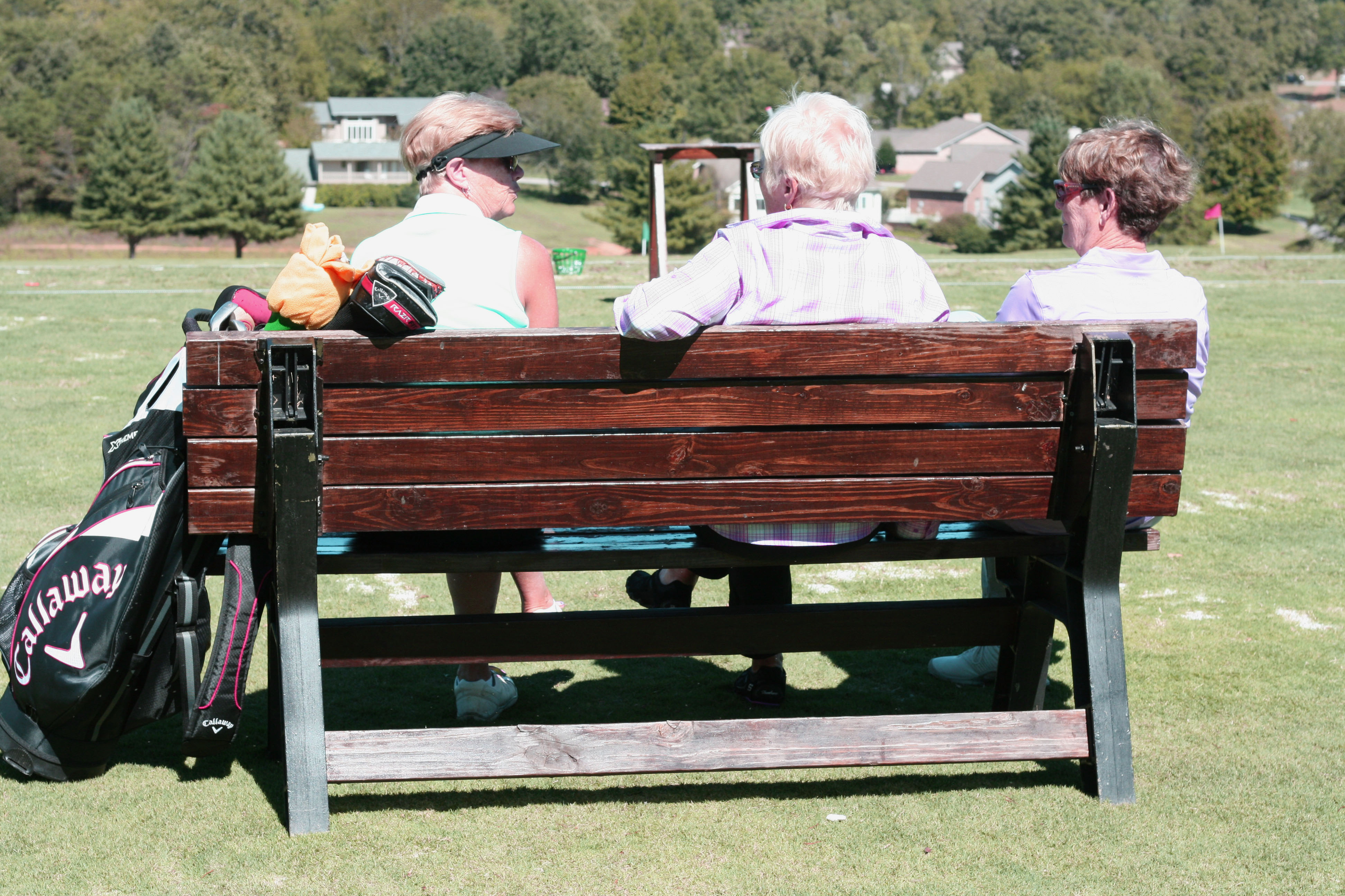 Toqua Golf Course, spectators sitting on bench.